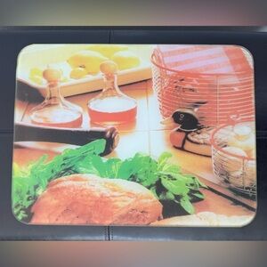 Tempered Glass Cutting Board with kitchen theme.